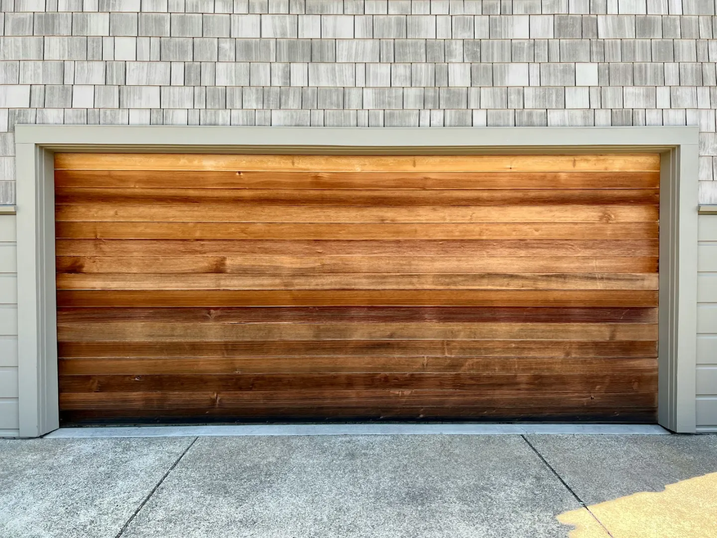 Contextual wood-look residential garage door